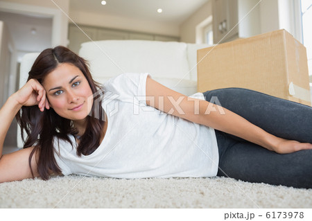 Brunette lying on the floor Brunette lying on the floor 6173978