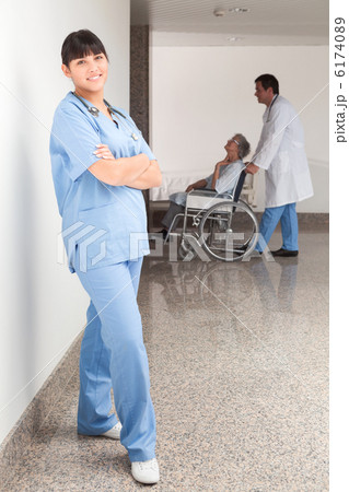 Proud nurse standing in the hallway Proud nurse standing in the hallway 6174089