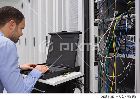 Man working with servers Man working with servers 6174898
