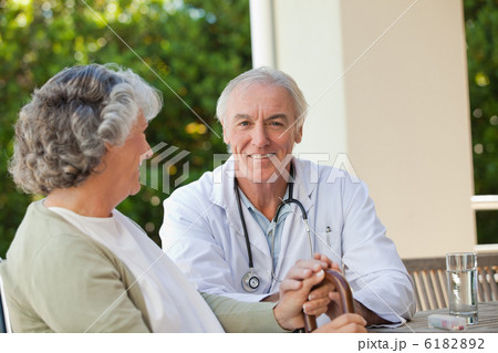 Senior doctor talking with his mature patient Senior doctor talking with his mature patient 6182892