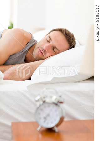 Relaxing man sleeping in his bed Relaxing man sleeping in his bed 6183117
