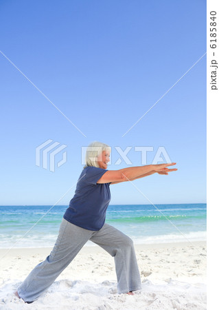 Retired woman doing her stretches Retired woman doing her stretches 6185840