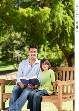 Son with his father reading a book Son with his father reading a book 6186948