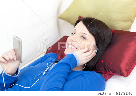 Happy woman listening music with headphones Happy woman listening music with headphones 6188146