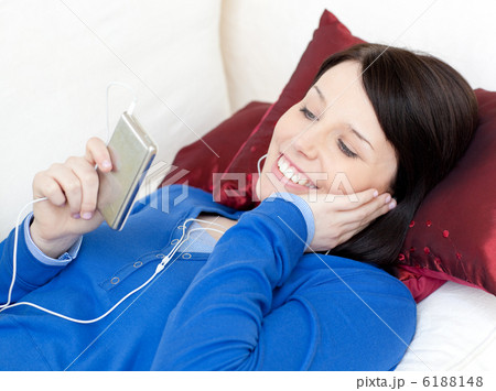 Cheerful woman listening music with headphones 6188148