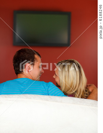 Couple watching a television at home Couple watching a television at home 6188246