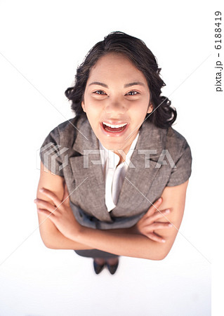 High angle of businesswoman laughing at the camera 6188419