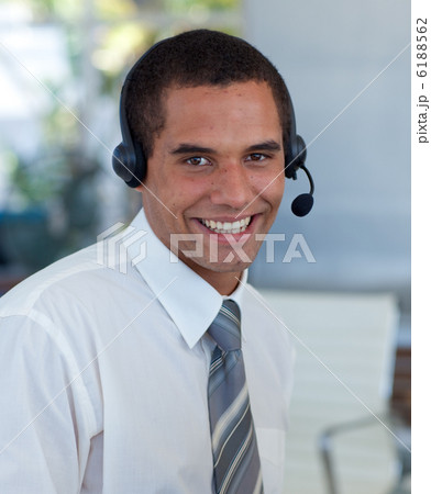 Attractive businessman working in a call center 6188562