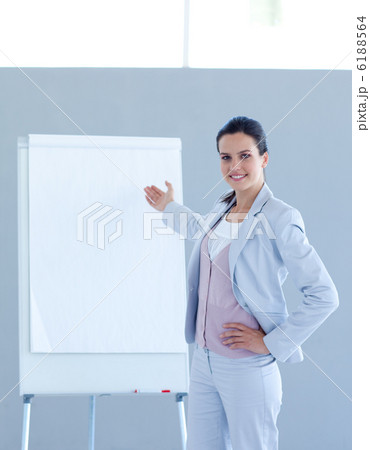 Businesswoman pointing to a whiteboard Businesswoman pointing to a whiteboard 6188564