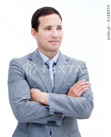 Portrait of a handsome businessman with folded arms standing 6188950