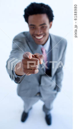 Smiling African businessman pointing at the camera Smiling African businessman pointing at the camera 6188980