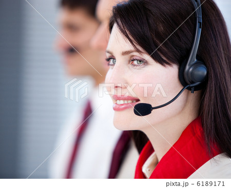 Concentrated sales representative team with an headset Concentrated sales representative team with an headset 6189171