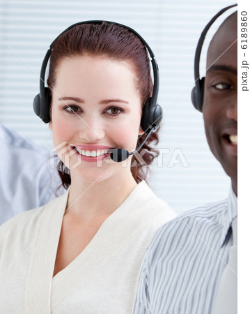 Self-assured customer service representatives standing in a line Self-assured customer service representatives standing in a line 6189860
