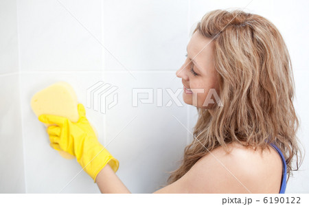 Attractive woman cleaning a bathroom Attractive woman cleaning a bathroom 6190122