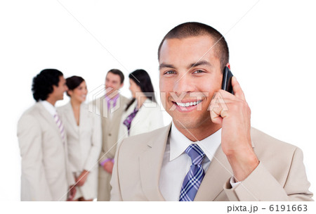 Portrait of caucasian businessman on phone with his team Portrait of caucasian businessman on phone with his team 6191663