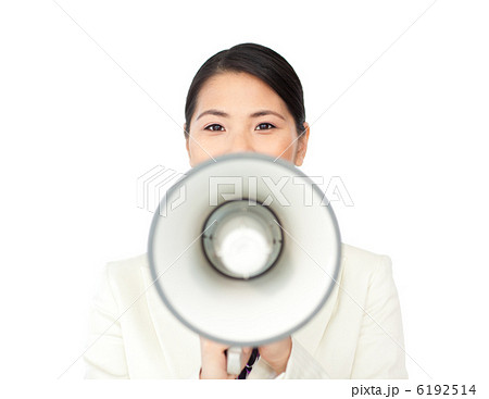Young businesswoman shouting through a megaphone 6192514