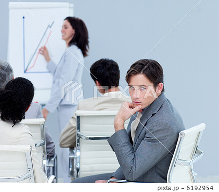 Bored charming businessman at a presentation 6192954