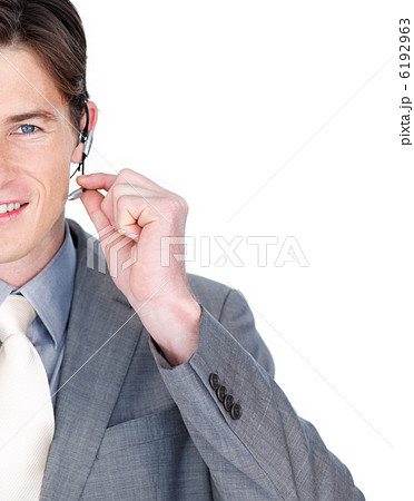 Close-up of a businessman talking on a headset Close-up of a businessman talking on a headset 6192963