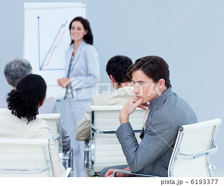 Bored young businessman at a presentation Bored young businessman at a presentation 6193377