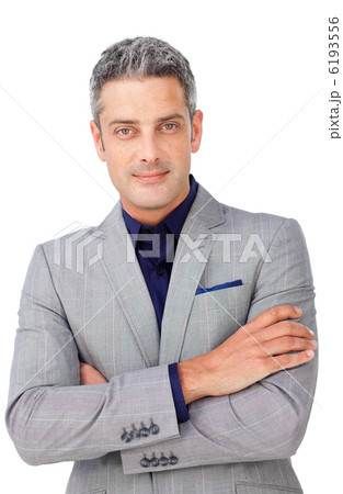 Charismatic businessman with folded arms 6193556
