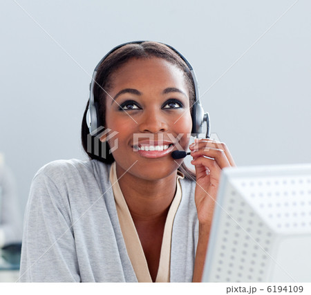 Portrait of a thoughtful businesswoman with headset on Portrait of a thoughtful businesswoman with headset on 6194109