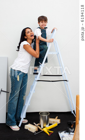 Cute little boy climbing a ladder Cute little boy climbing a ladder 6194118