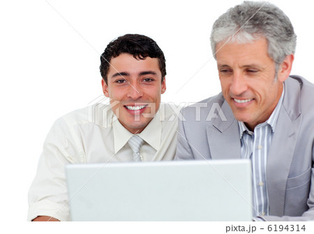 Charming business co-workers using a laptop 6194314