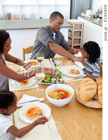 Cheerful family dining together 6194909