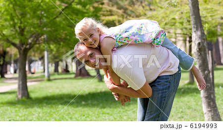 Cute little girl having fun with her father 6194993