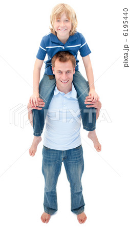 Portrait of father giving his son piggyback ride Portrait of father giving his son piggyback ride 6195440