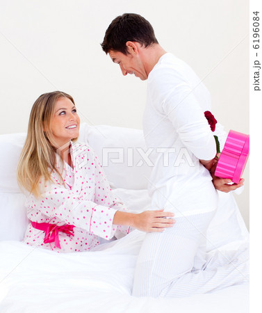 Lovely husband giving a present to his wife 6196084