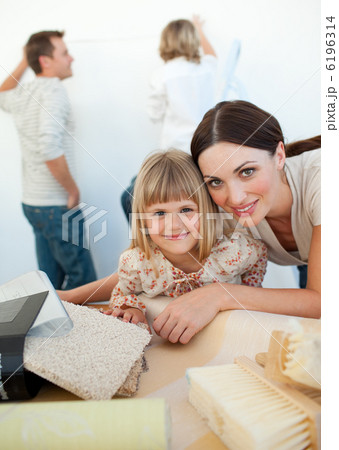 Young family decorating a room 6196314