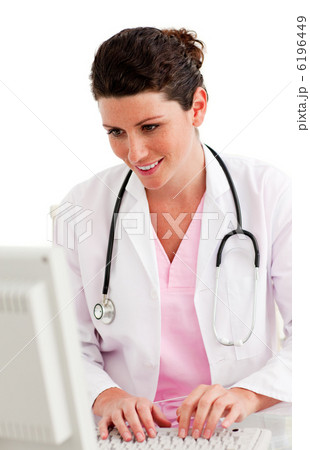 Female doctor working at a computer 6196449