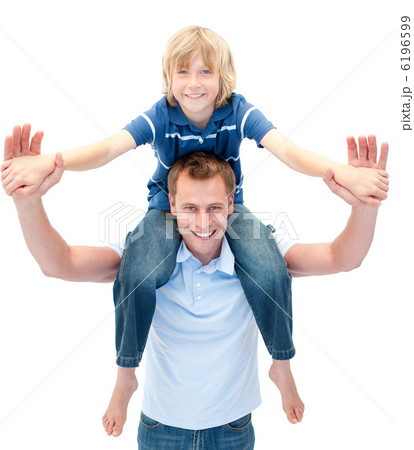 Charming father giving his son piggyback ride 6196599
