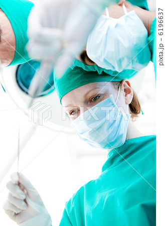Self-assured surgeons during an operation Self-assured surgeons during an operation 6196637