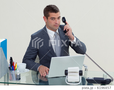 Serious businessman phone in his office Serious businessman phone in his office 6196857