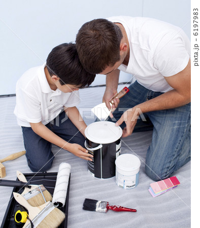 Father and son painting a bedroom 6197983