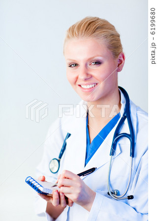 Female doctor writing a perscription 6199680