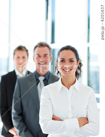 Smiling businesswoman with folded arms in a line 6201637