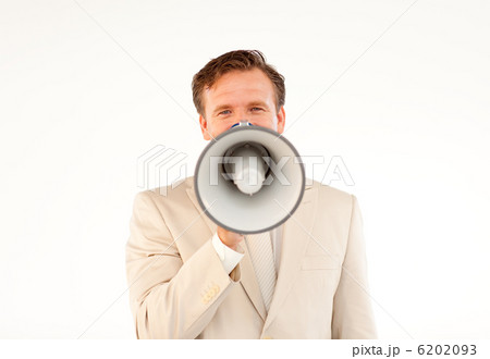 Mature businessman making a announcement via a megaphone Mature businessman making a announcement via a megaphone 6202093