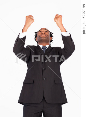 Businessman with raised arms looking upwards Businessman with raised arms looking upwards 6202199