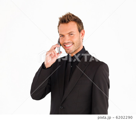 Smiling male business manager on the phone Smiling male business manager on the phone 6202290