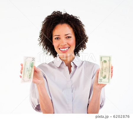 Portrait of an ethnic businesswoman holding dollars 6202876