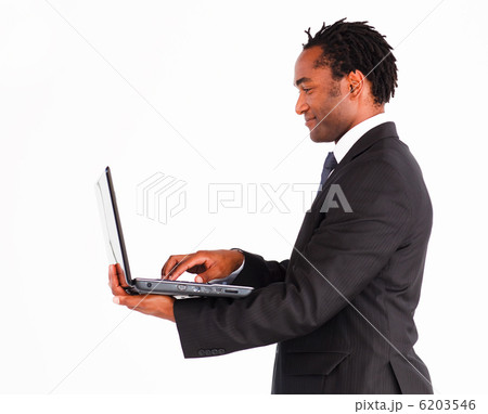 Friendly businessman working on laptop 6203546