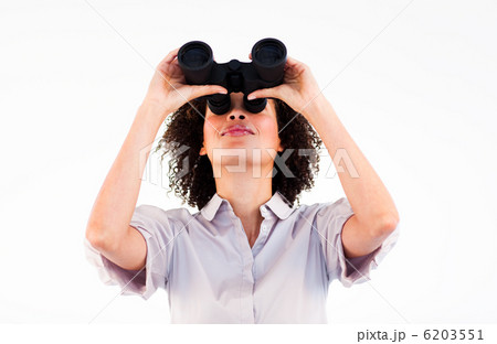 Confident businesswoman looking upwards through binoculars 6203551