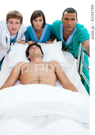 Emergency scene: medical team carriyng a patient 6204780