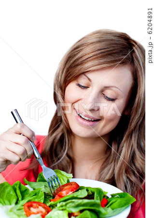 Cute woman is eating a salad Cute woman is eating a salad 6204891