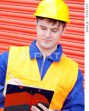 Mature male engineer writing his report Mature male engineer writing his report 6205120