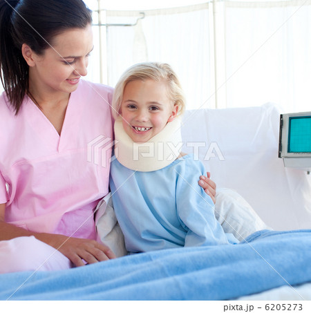 Smiling patient with a neck brace and her nurse 6205273