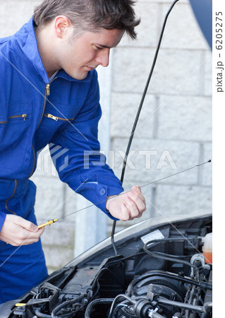 Professional man repairing a car 6205275